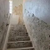 The stairs that lead to the cells.