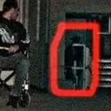 Shadow Hallway 2013 - a man was sitting in the wheel chair and he heard something behind him - he turned to look - and his wife snapped the photo and captured a shadow man behind him.