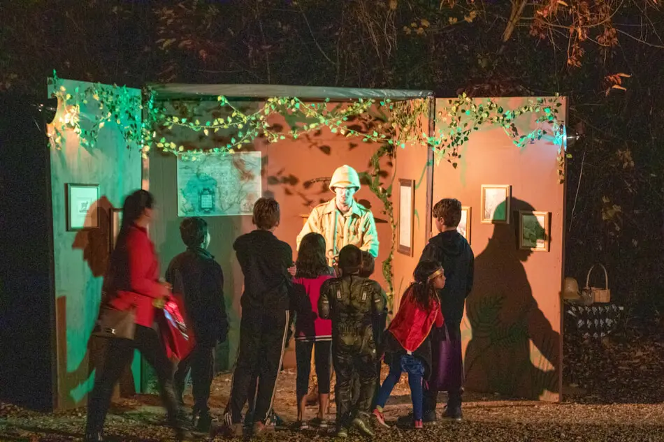 Our event features a walk through a forest trail. The trail is filled with exhibits operated by theater actors.