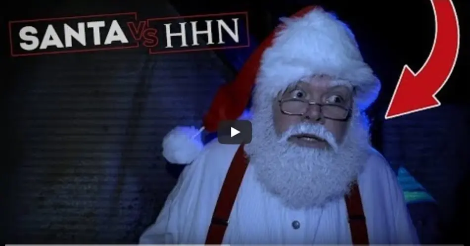 Santa Claus walks through a Halloween Horror Nights Haunted House